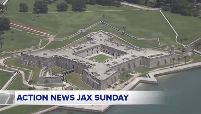 Aerial view of Castillo de San Marcos fort surrounded by water and green lawn, with 'Action News Jax Sunday' text overlay.