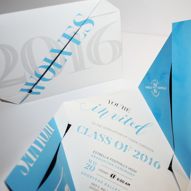 A photo of an intricate folded highschool graduation invitation design