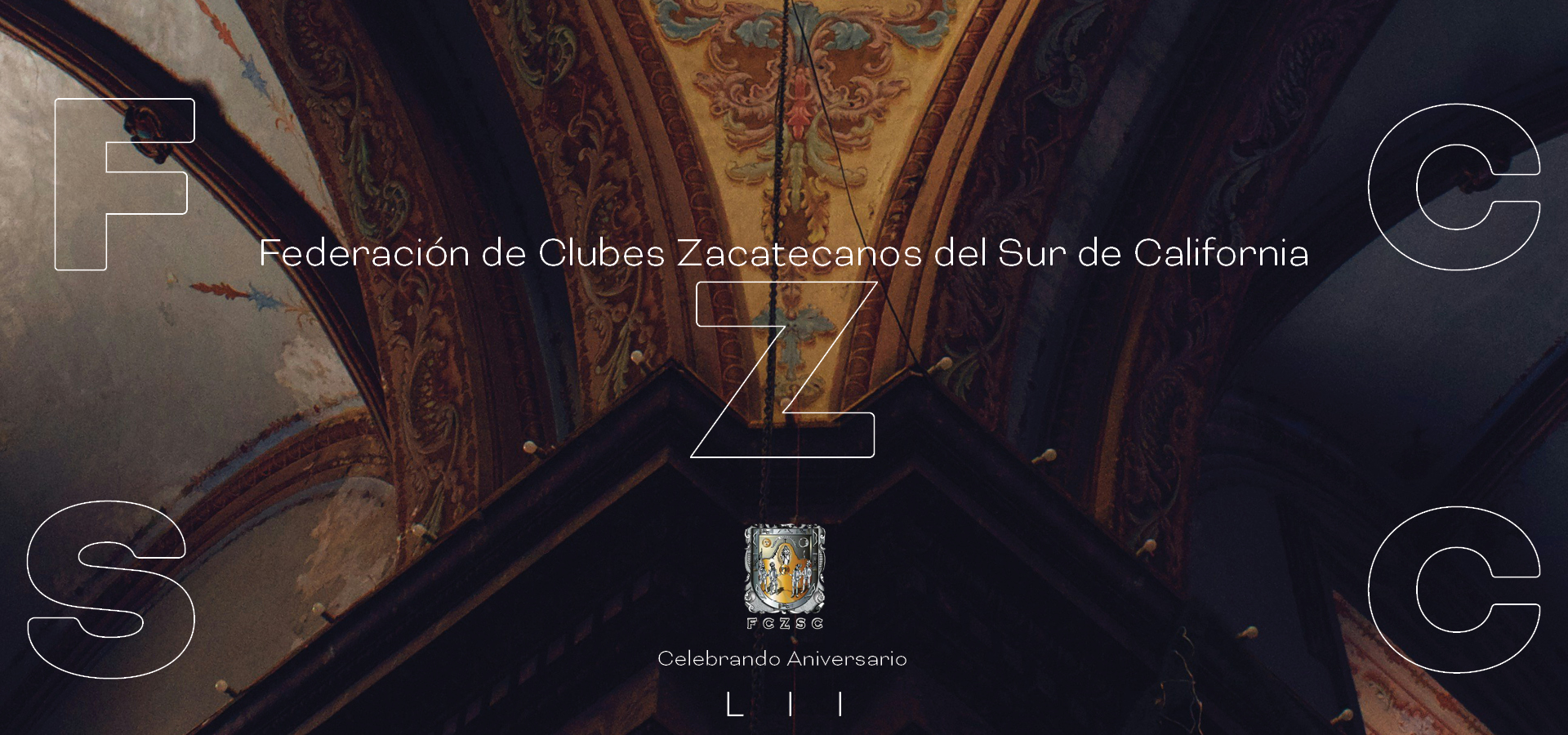 Ornate decorated ceiling with arched design and emblem of Federación de Clubes Zacatecanos del Sur de California centered below text celebrating anniversary LII.