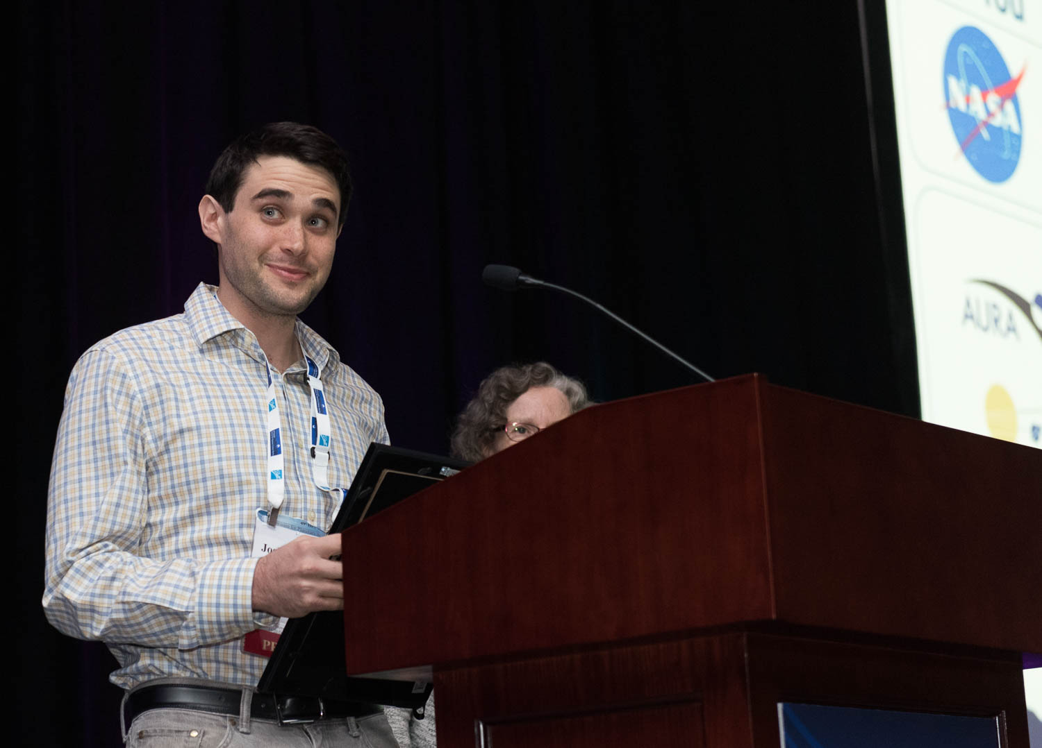 Sokol accepting the Jonathan Eberhart Planetary Sciences Journalism Award. Photo by Henry Throop.