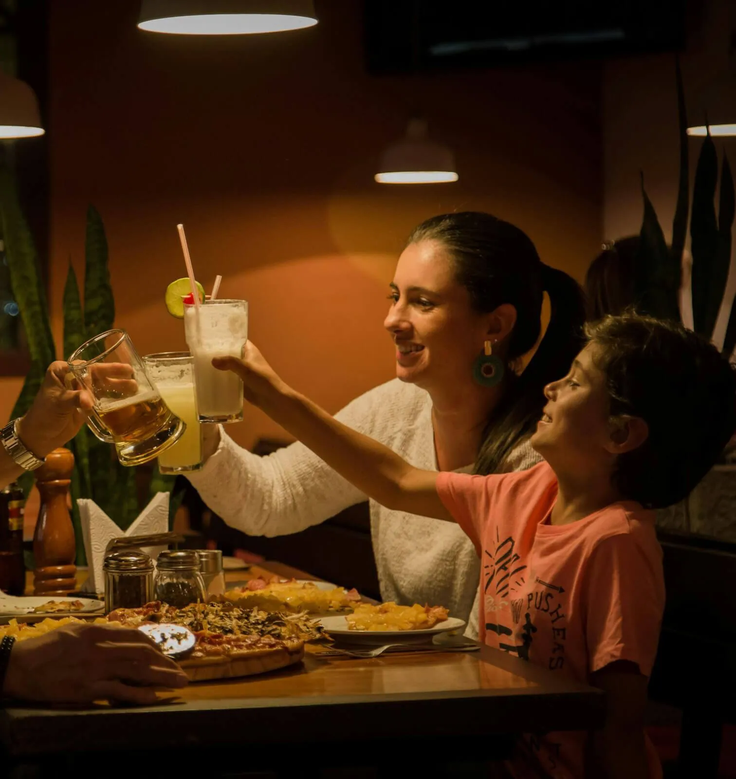 Happy family with pizza
