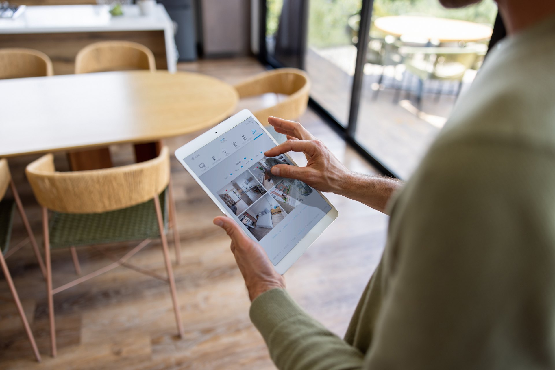 Tablet controlling multiple home systems from one interface