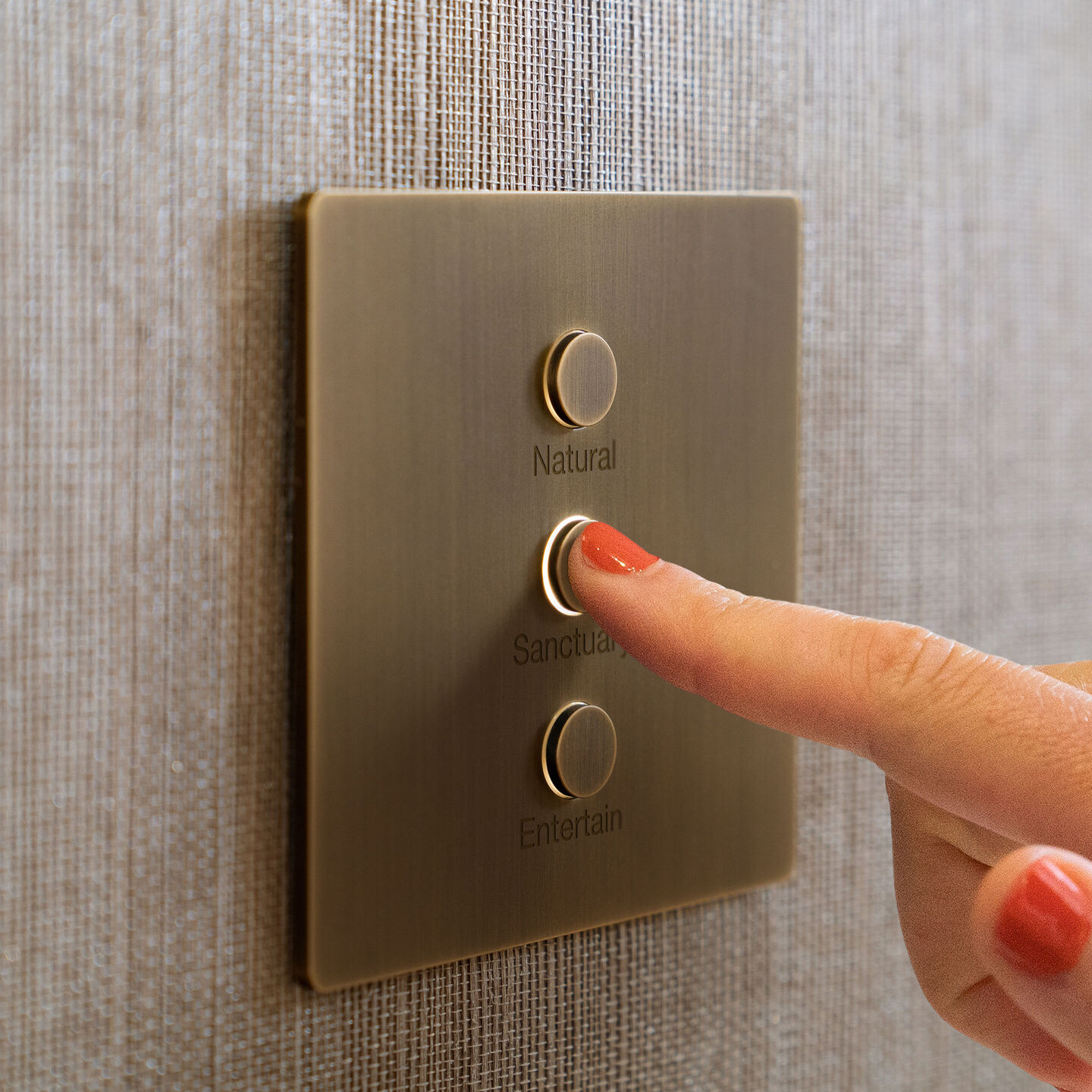 Lutron Alisse three-button keypad with illuminated halos and engraved scenes