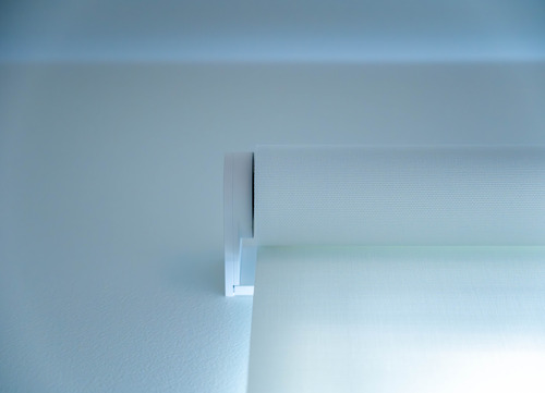 Architectural motorized shades integrated into a custom home