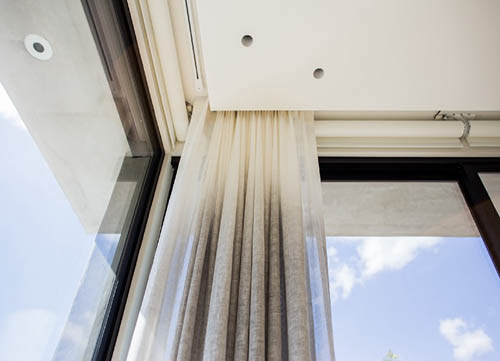 Motorized shades integrated into a modern Los Altos Hills residence