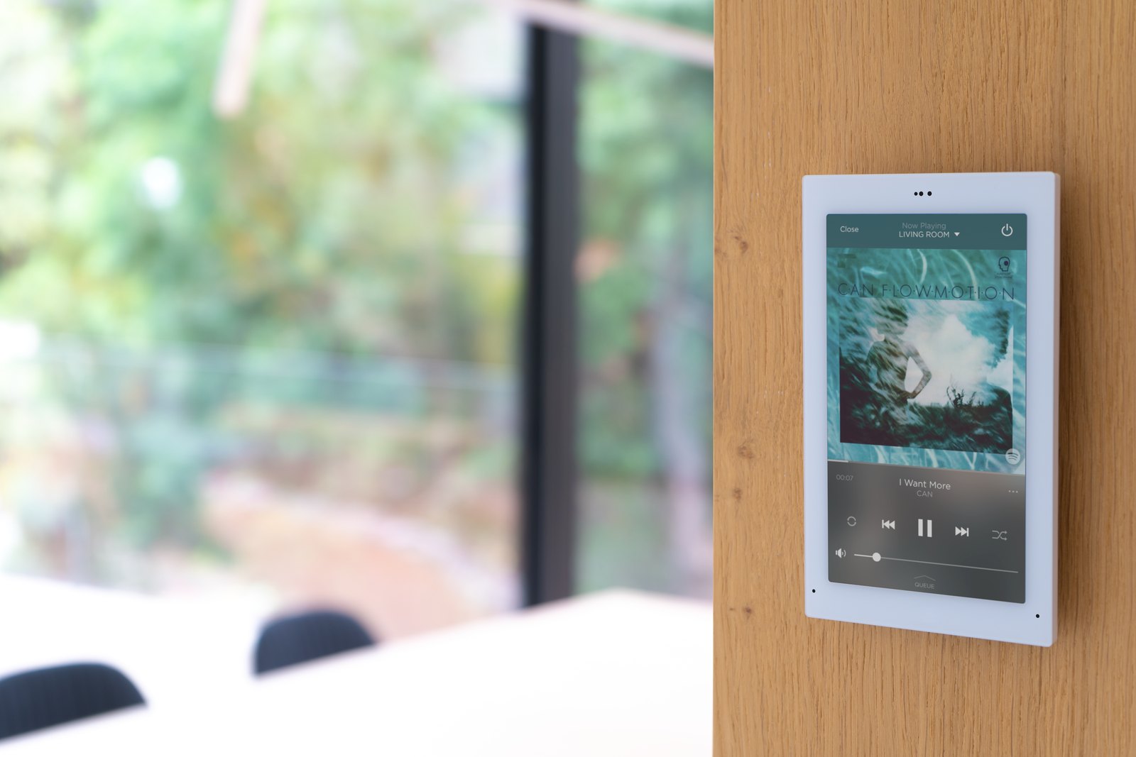 Savant touch panel showing whole-home music playback controls