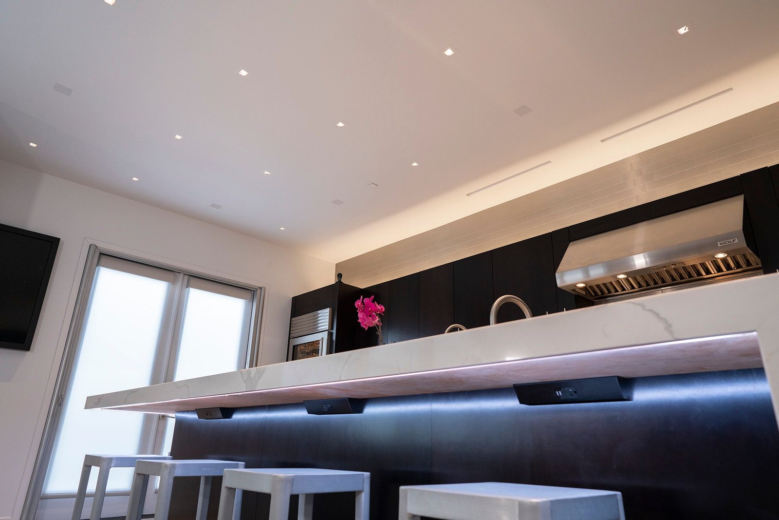 Modern kitchen with low-visibility flush architectural ceiling speakers
