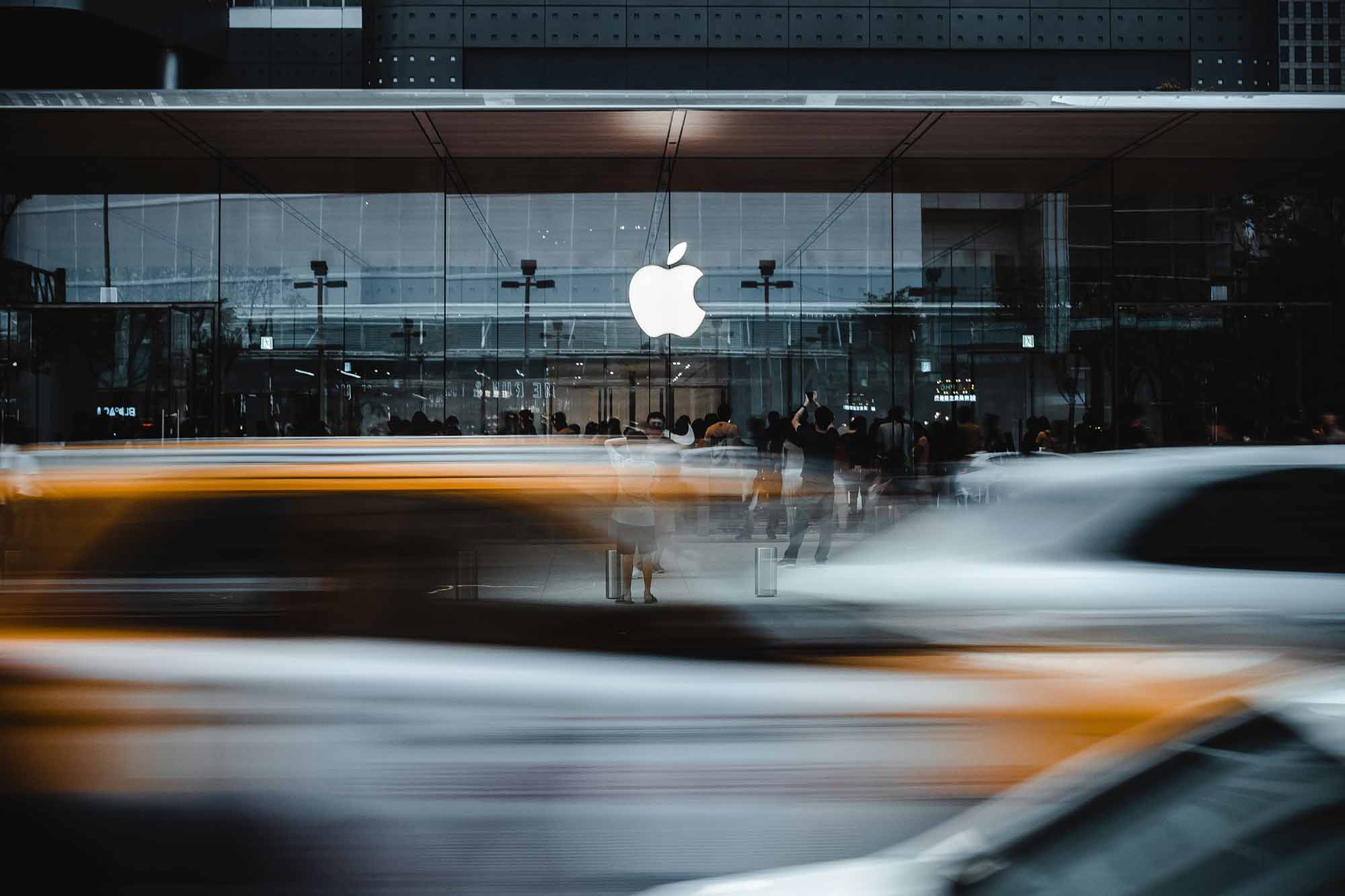 The apple logo in a busy city environment.