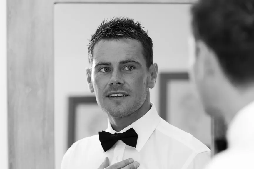 Groom kissing  at Zoetry Majorca by by Andrew Hazard wedding photographer 