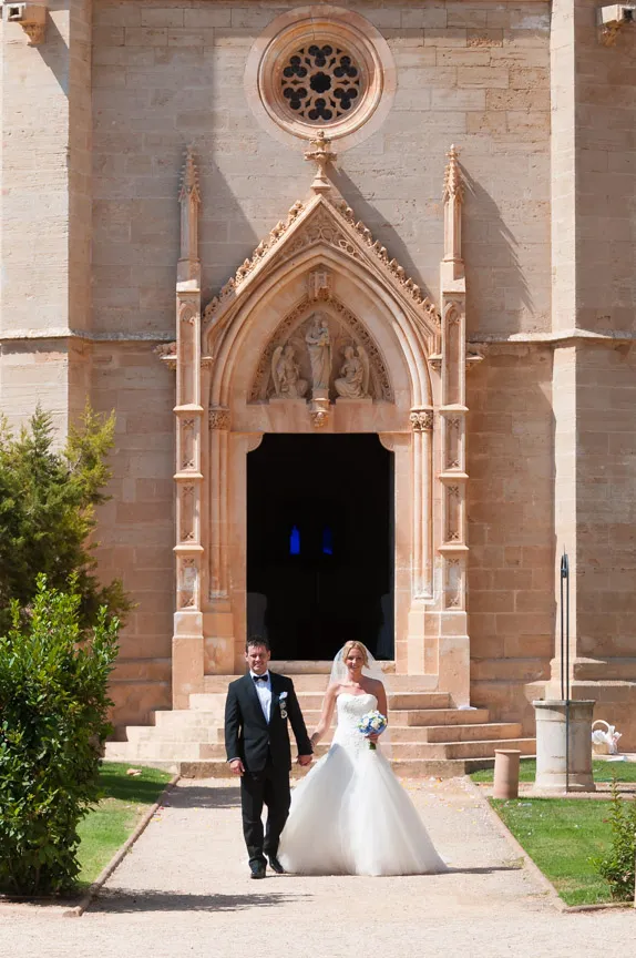 Bride & groom walking outside chapel  at Zoetry Majorca by by Andrew Hazard wedding photographer 