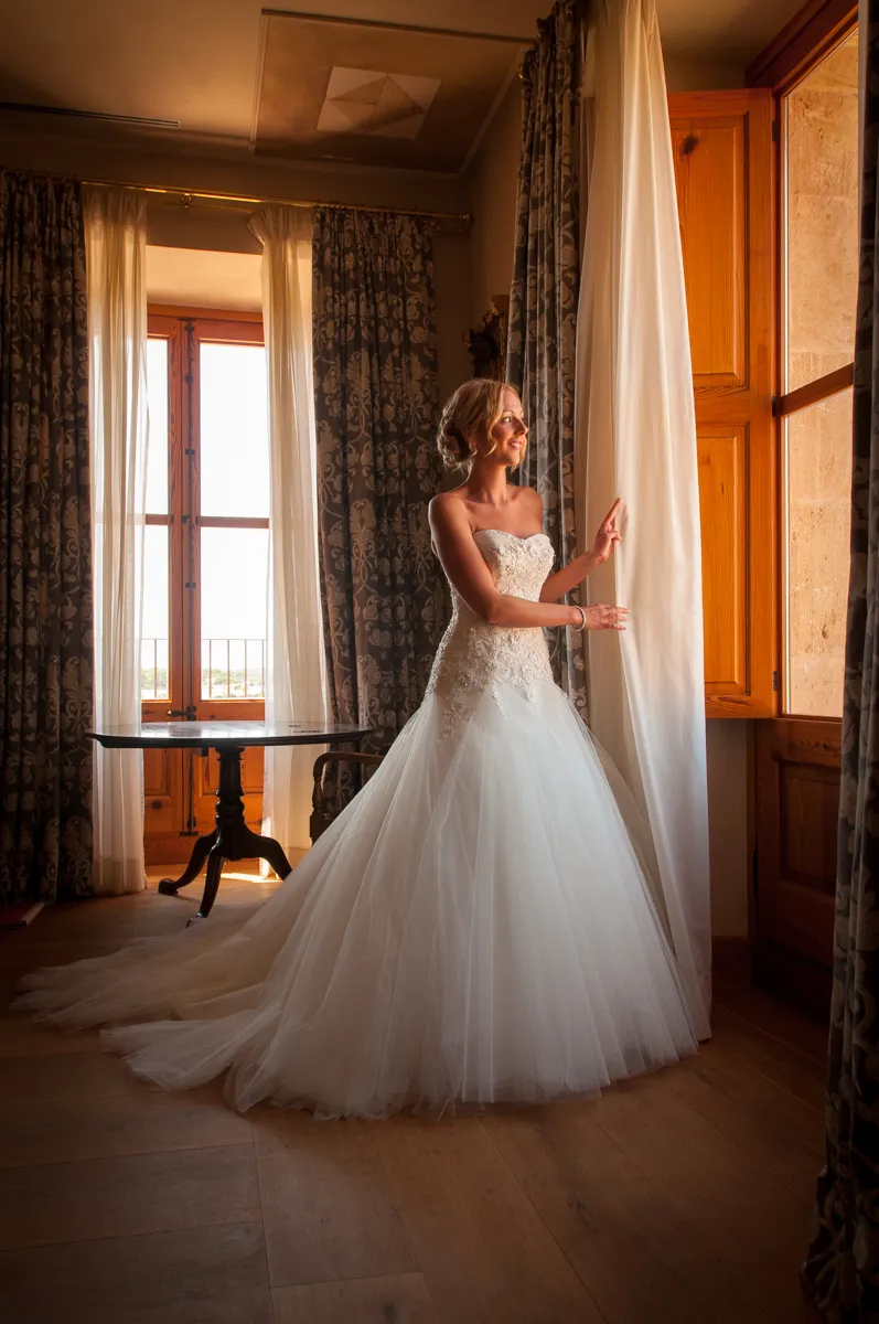 Bride at window  at Zoetry Majorca by by Andrew Hazard wedding photographer 
