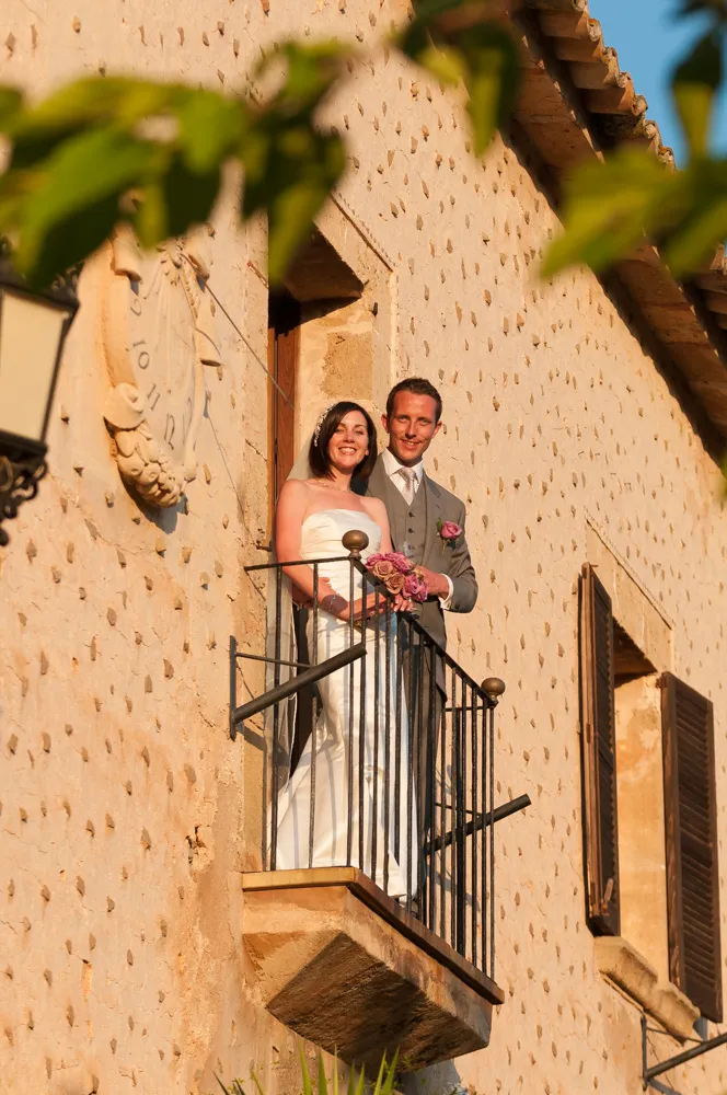 couple smiling on balcony at Son Bosch Andratx