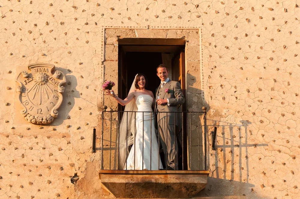 couple smiling on balcony at Son Bosch Andratx