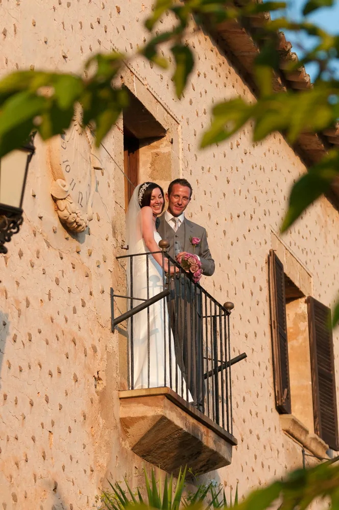 couple smiling on balcony at Son Bosch Andratx