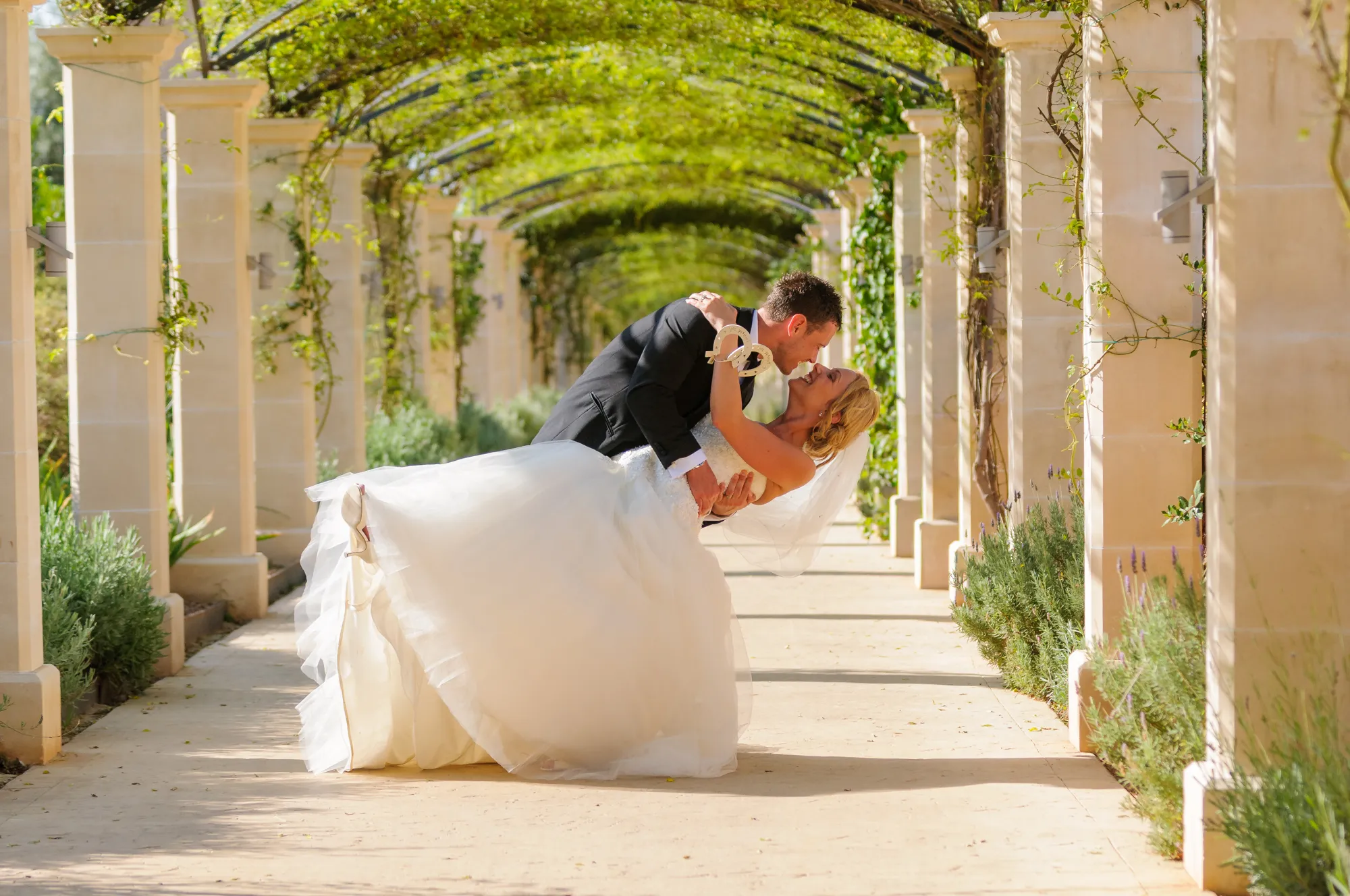 Bride & groom hugging at a wedding at Zoetry Majorca by Andrew Hazard Photography