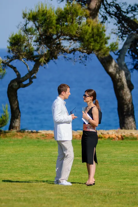 Can Simoneta outdoor wedding guests with Mediterranean Sea in background by Andrew Hazard Photography