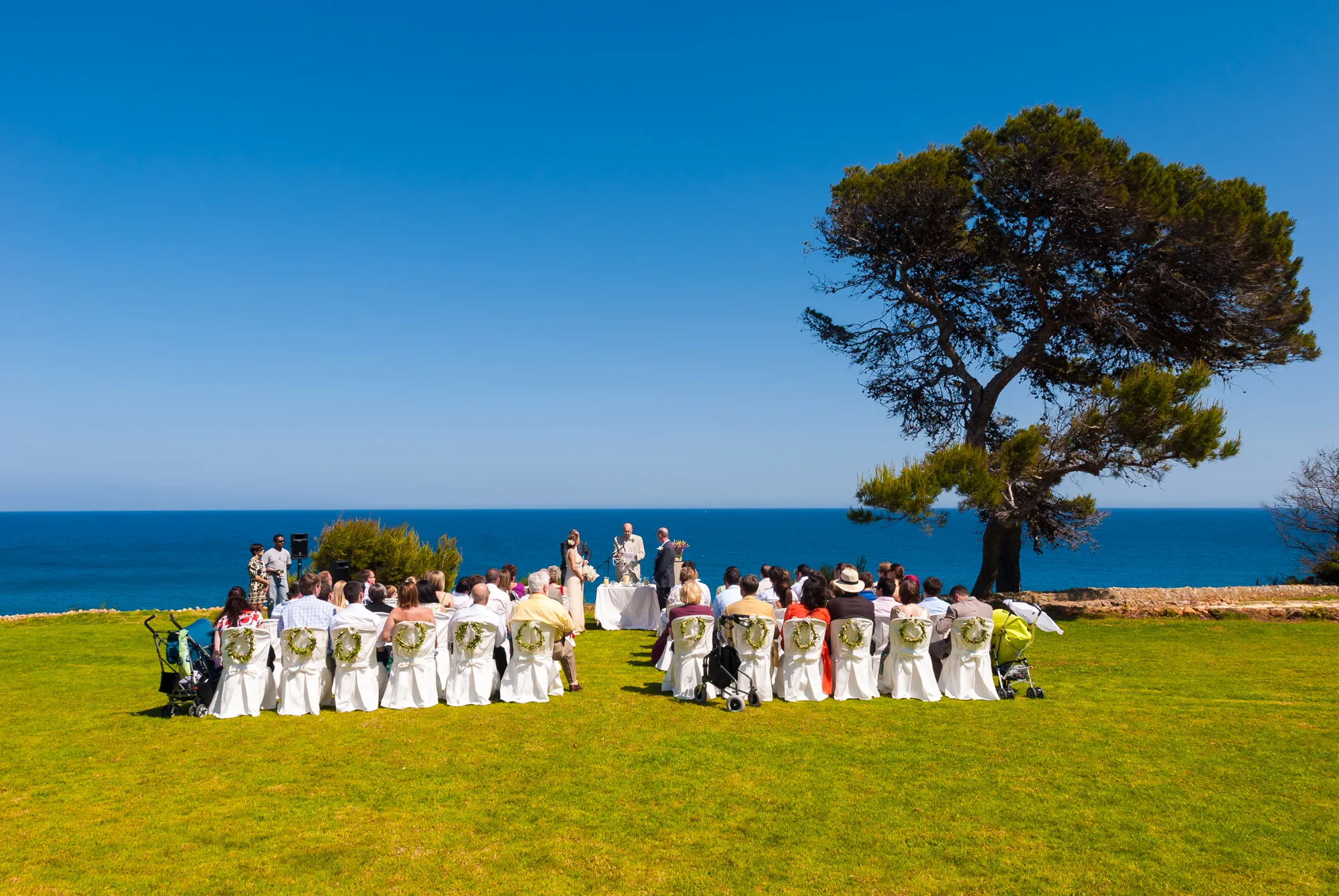 Can Simoneta outdoor wedding ceremony on clifftop with Mediterranean Sea in background by Andrew Hazard Photography