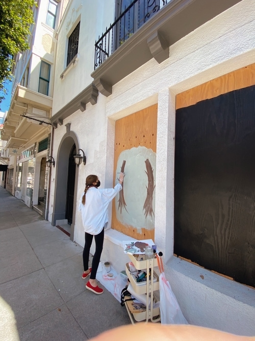 Emily Kolodny beginning her mural in Hayes Valley, San Francisco