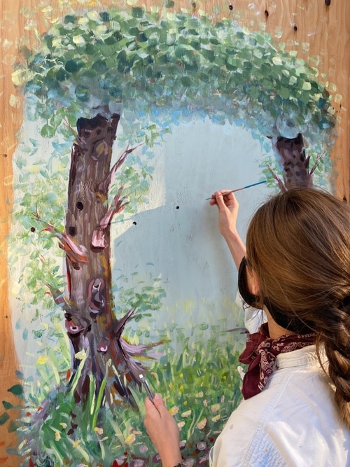 Emily Kolodny painting her mural in Hayes Valley, San Francisco