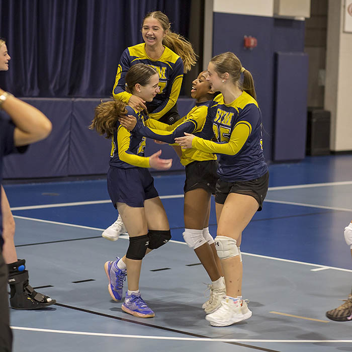 Players celebrate during a girls basketball match