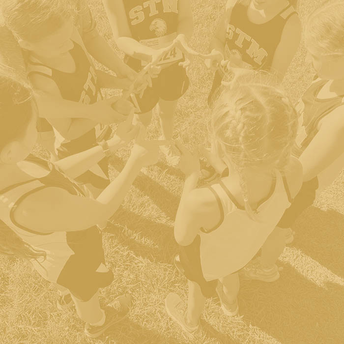 Students huddle before a cross country event