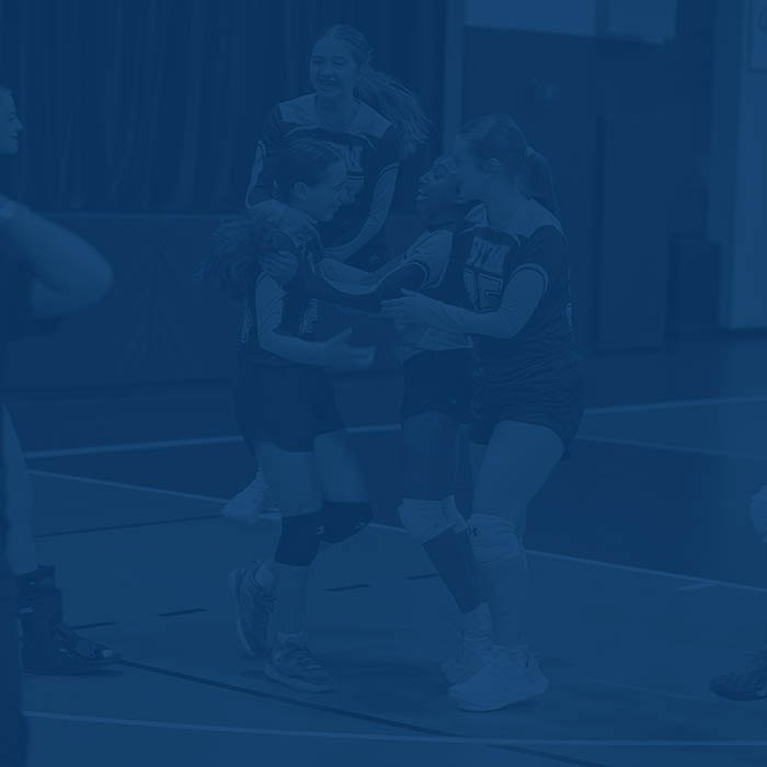 Players celebrate during a girls basketball match