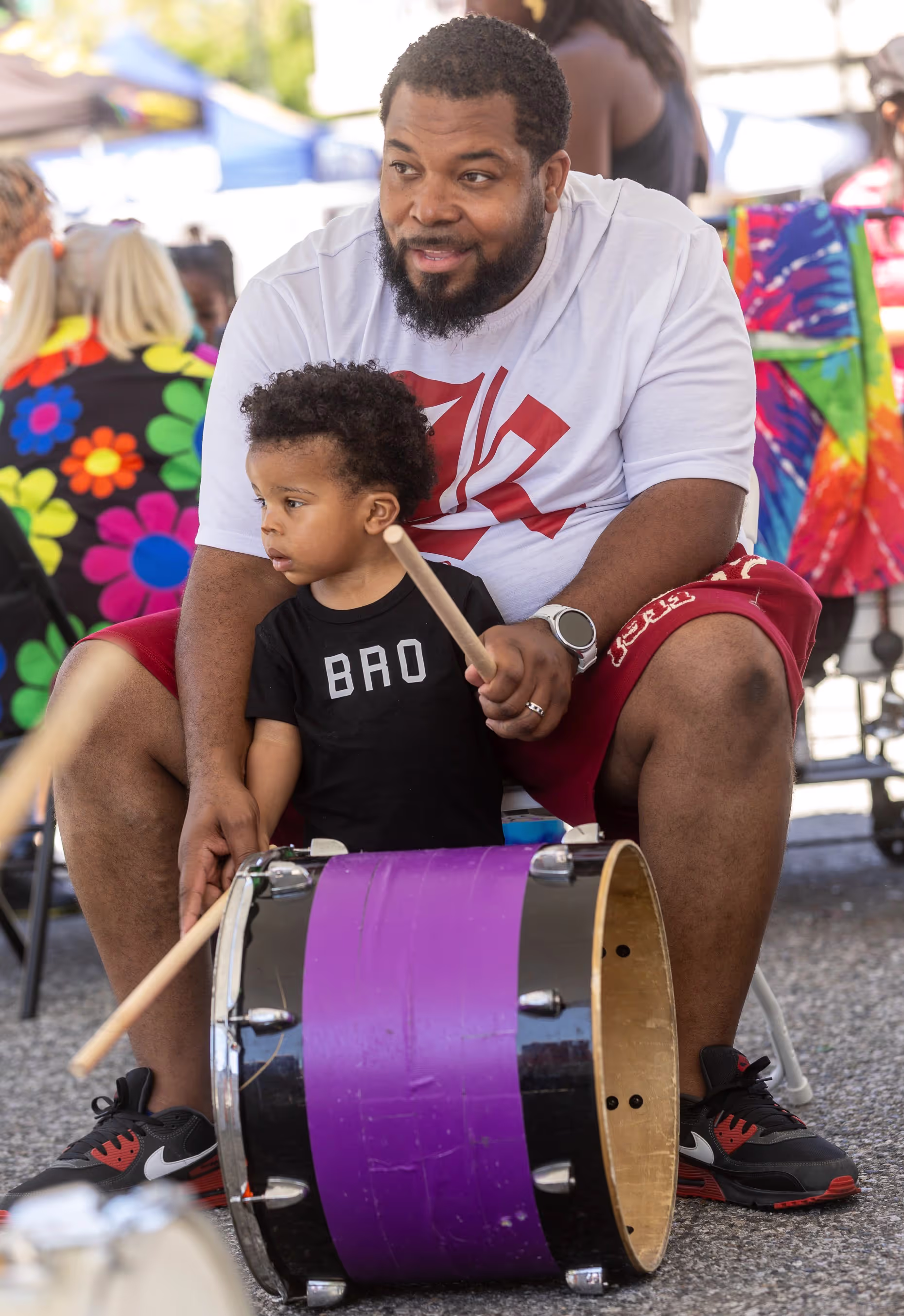 Anthone Jackson and his son Amanee, 1, learn how to play the drums during a workshop at the Juneteenth celebration, Saturday, June 15, 2024, in the SoFa District of San Jose, Calif. (Karl Mondon/Bay Area News Group) 