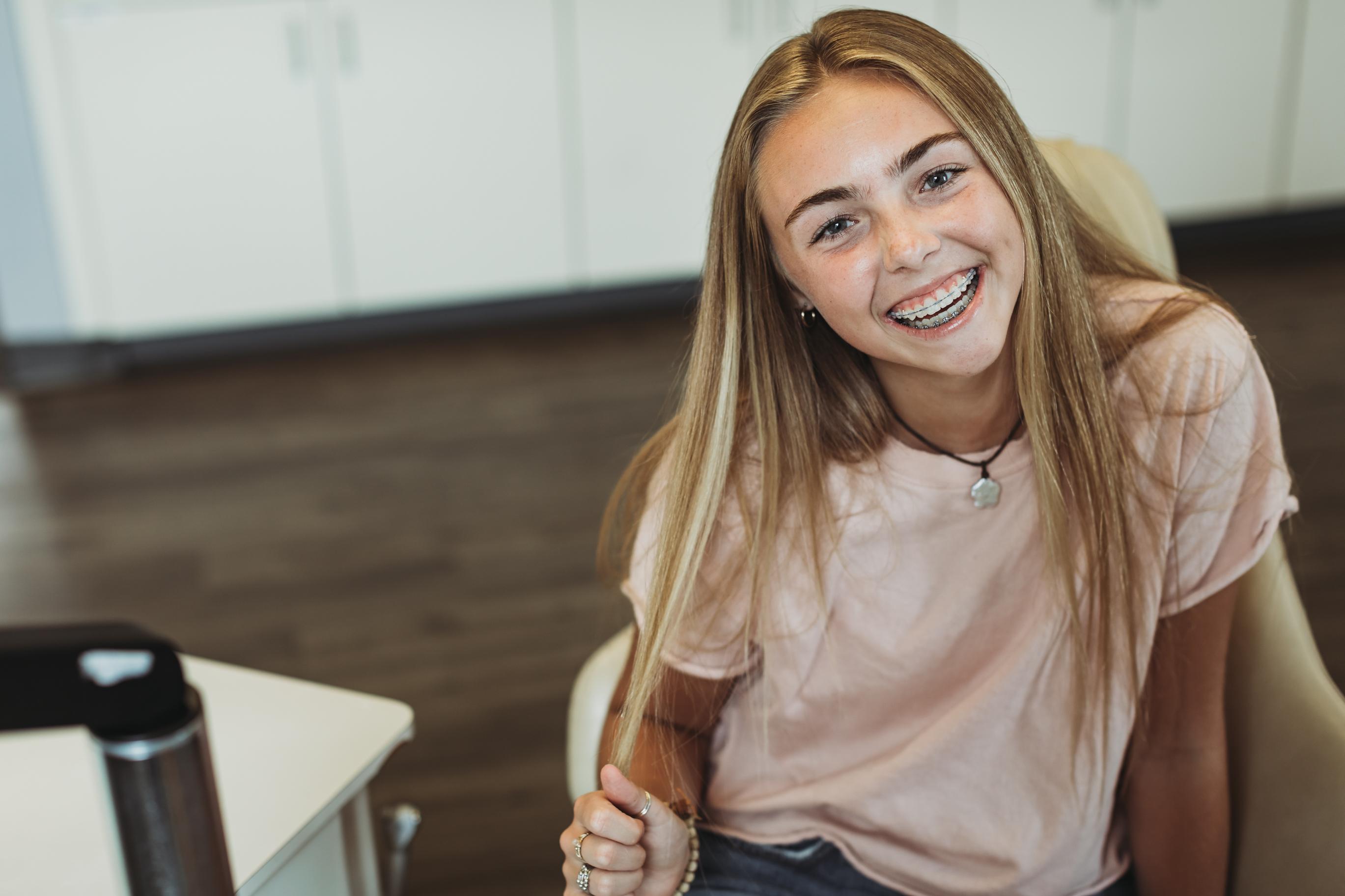 A Teen with Clear braces in the Brentwood TN Orthodontic office of Dr. Craig Starling
