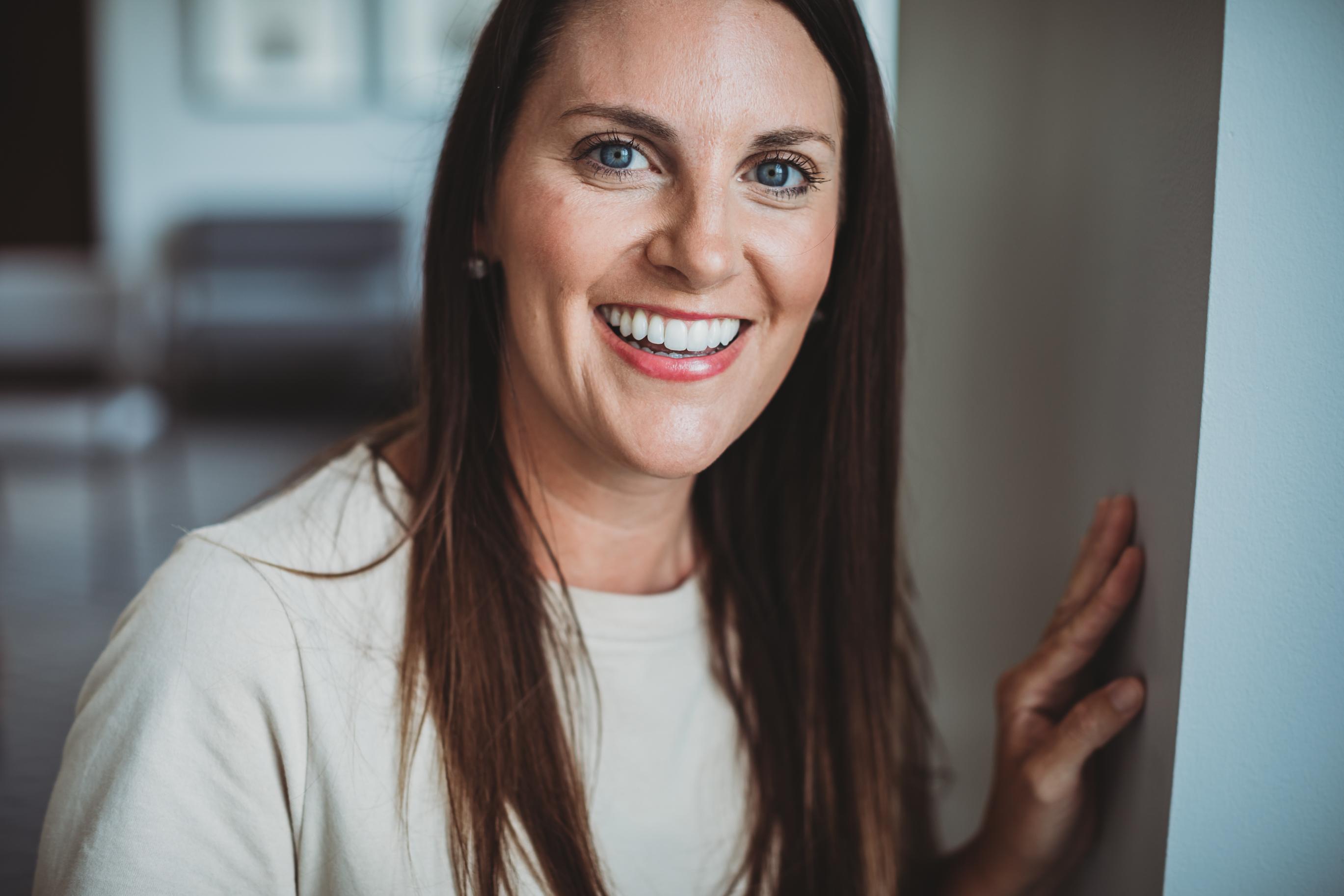 Adult woman smiling with straight teeth during lingual braces treatment at Starling Orthodontics in Brentwood, TN