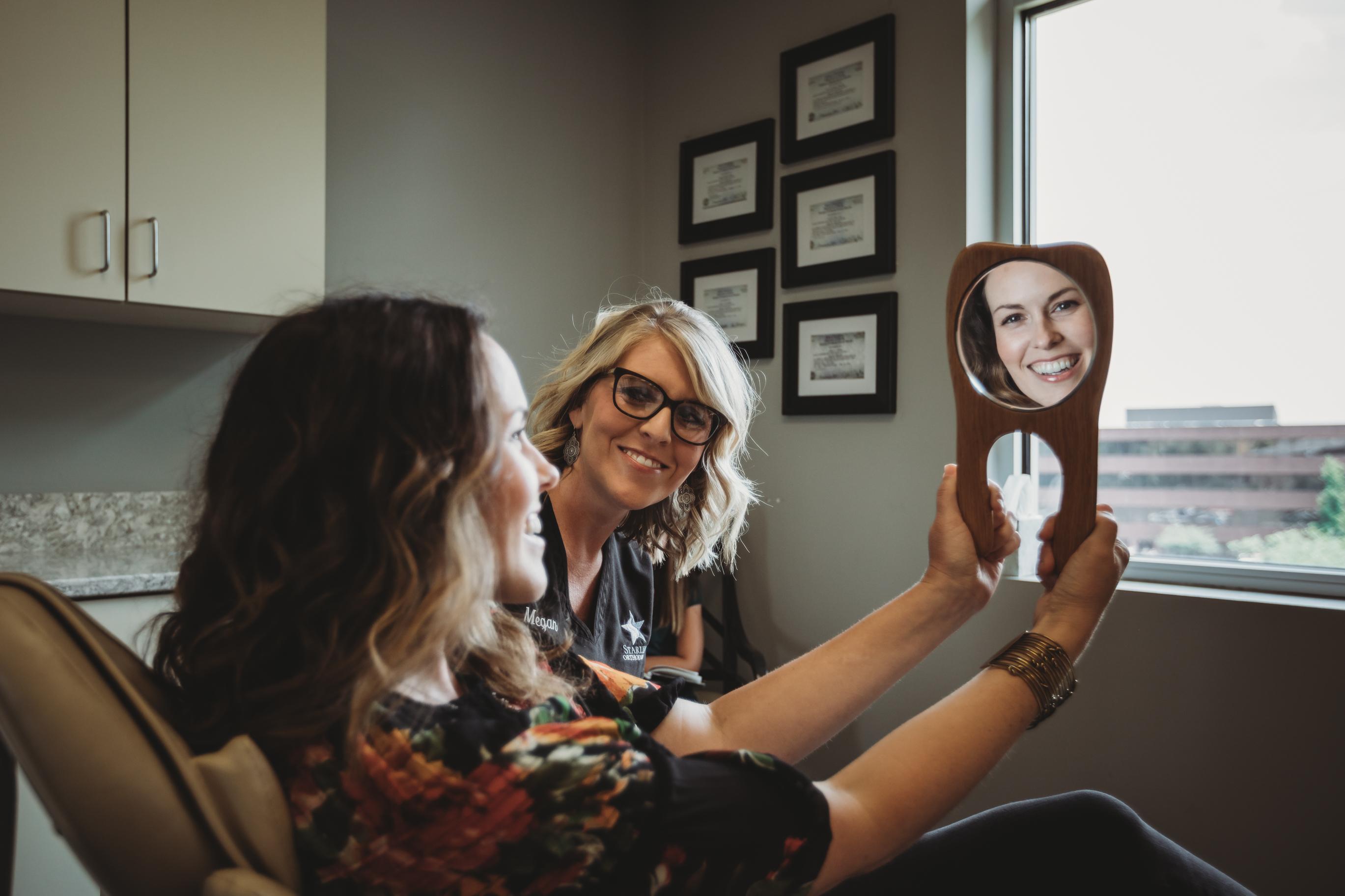 Adult smiling with lingual braces on in Nashville Orthodontic Office Starling Orthodontics