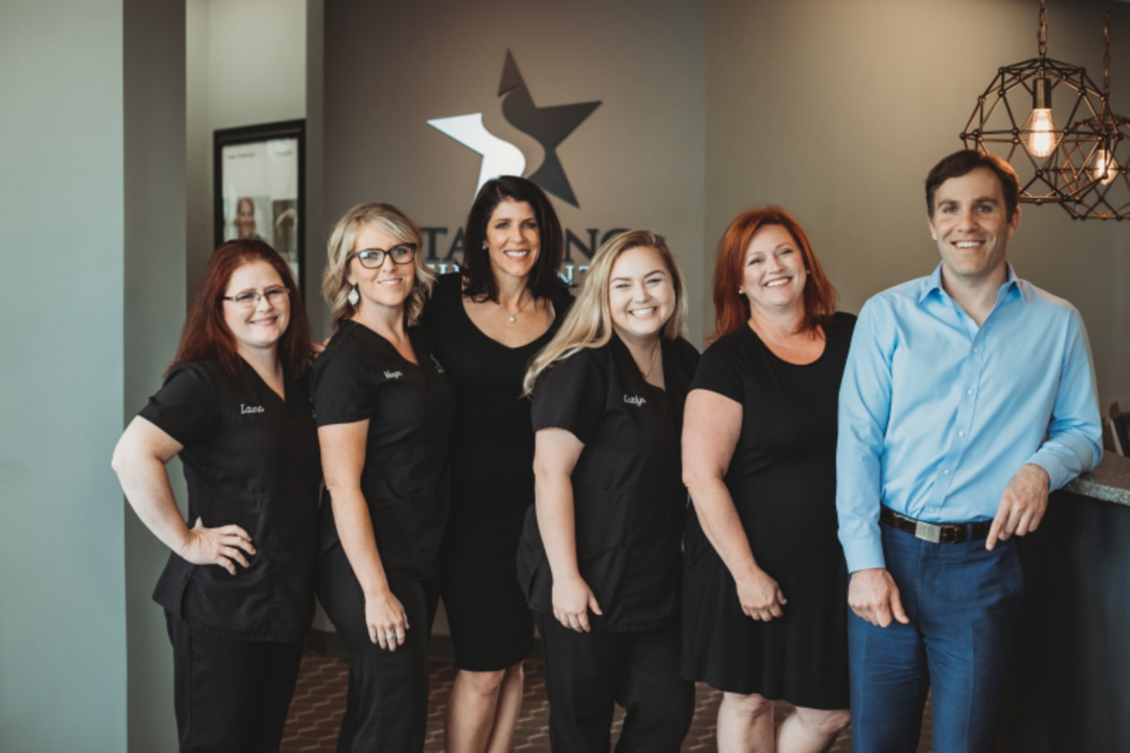 Starling Orthodontics team portrait with staff members in professional attire
