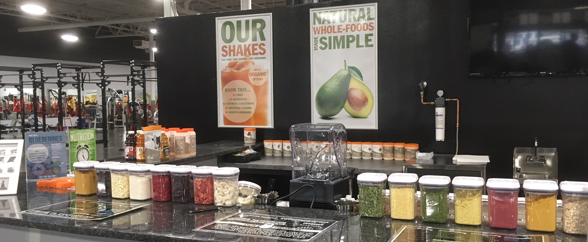 Juicebar counter with equipment and supplies neatly placed on the work surface.