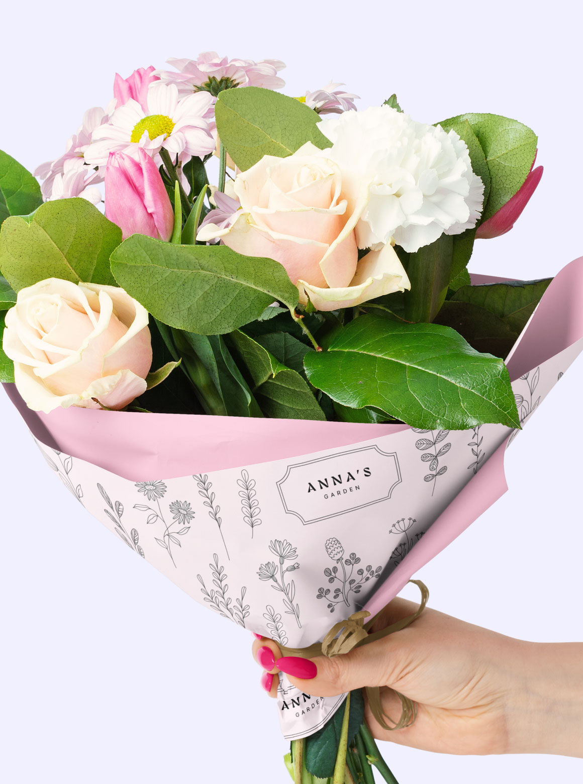 A bouquet of flowers wrapped in custom branded floral wax tissue paper