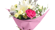 Bouquet of flowers wrapped in pink waxed floral tissue paper