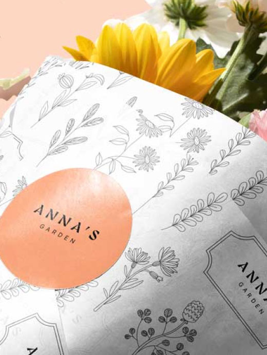A bouquet of flowers wrapped in custom printed wax tissue paper