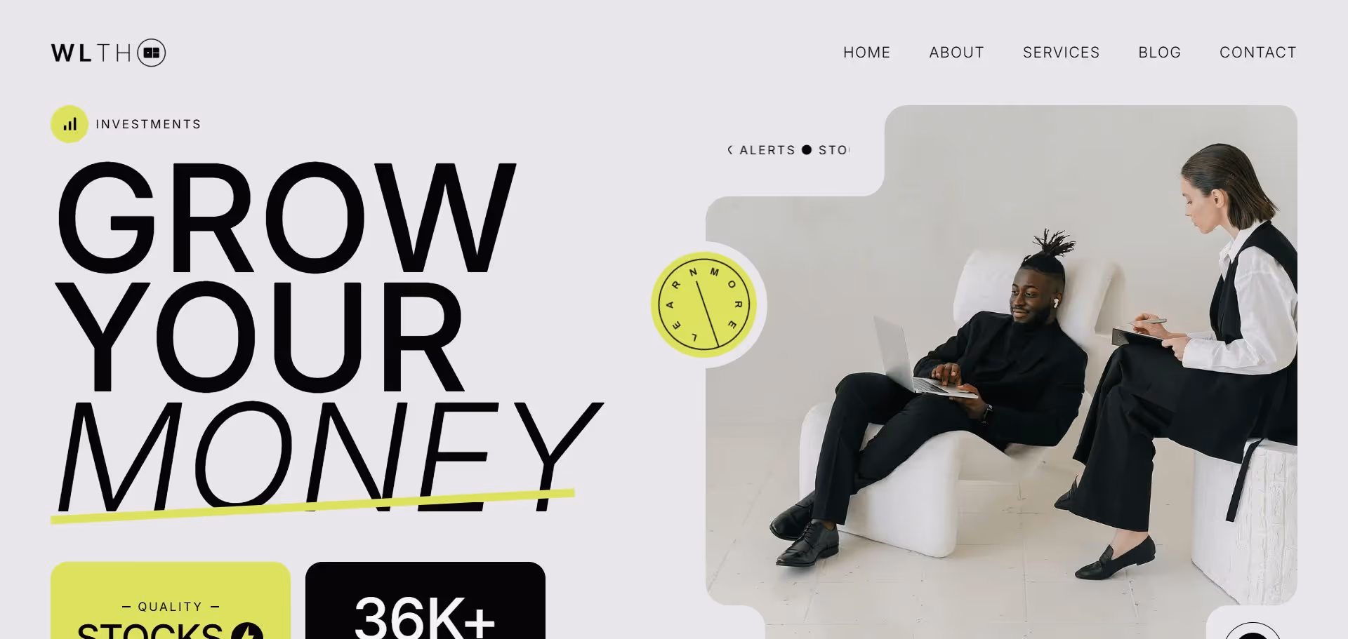 Two professionals in black suits, one using a laptop and the other taking notes, seated on modern white chairs.