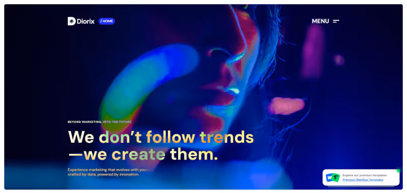 Dark, stylized close-up of a person's face with neon blue and purple lighting and the text 'We don't follow trends — we create them.'