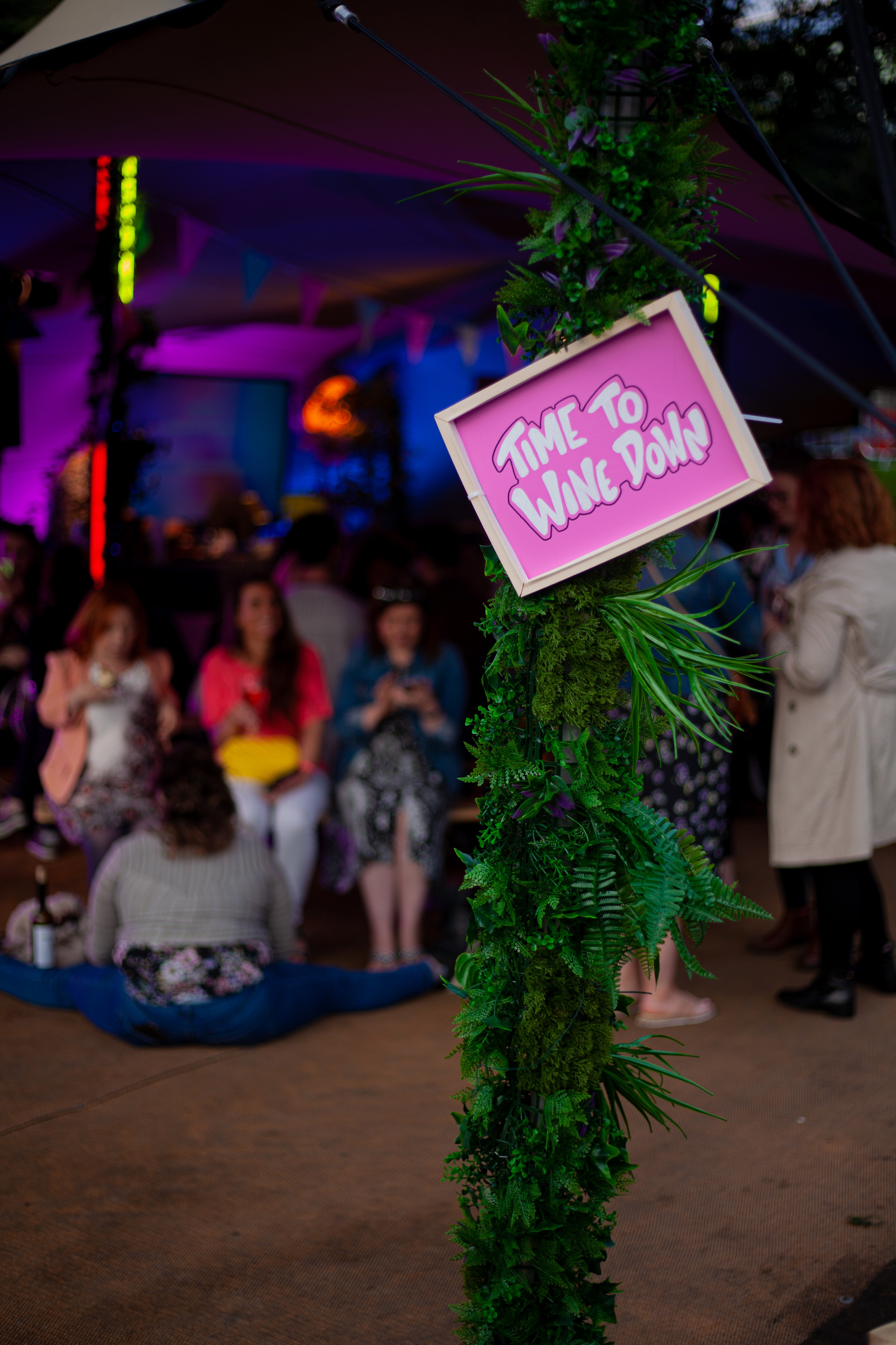 A sign with fun typography saying "Time to Wine Down" at the Wine & Cheese Festival, Dublin