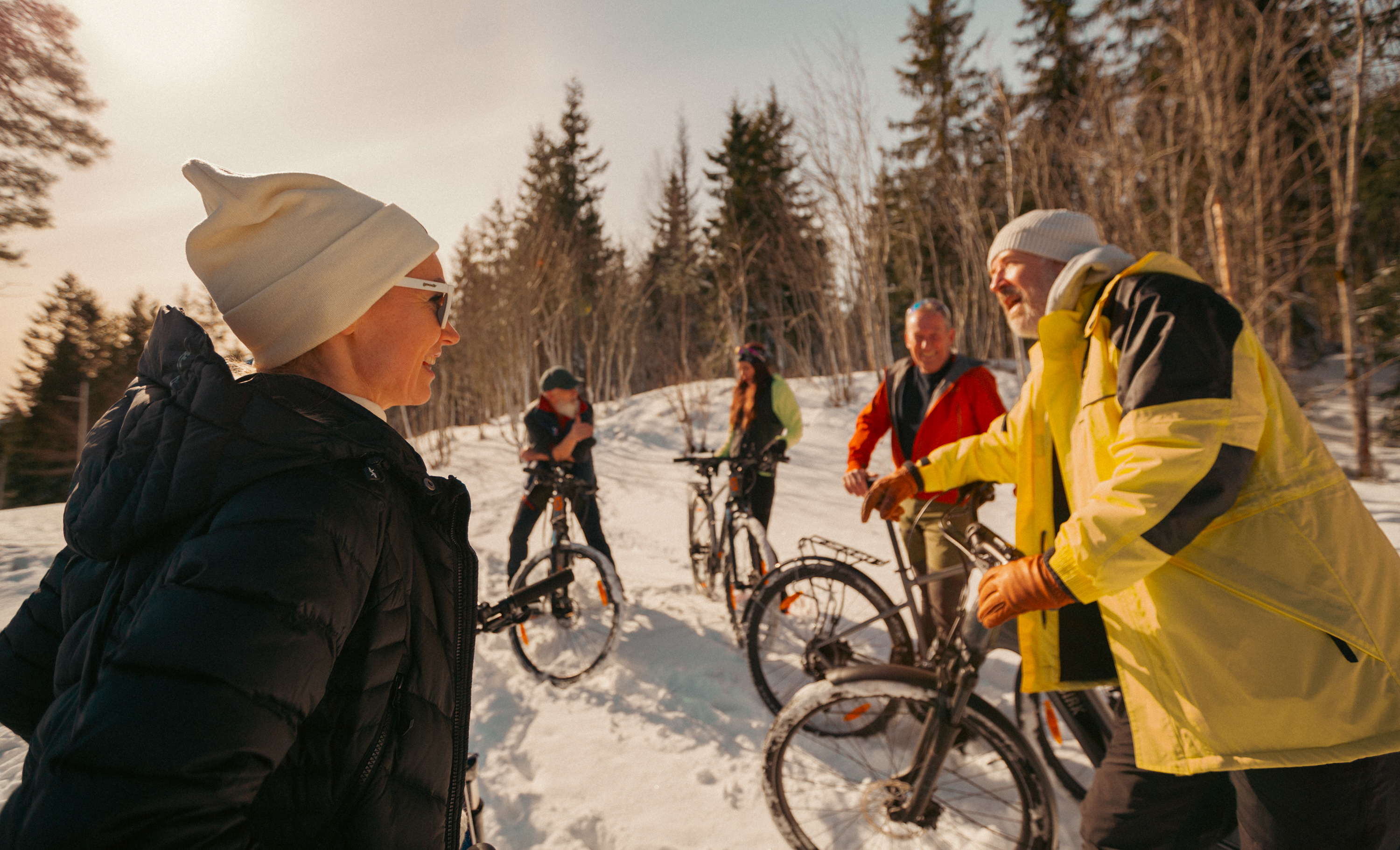 a group with bikes in the forest on snw