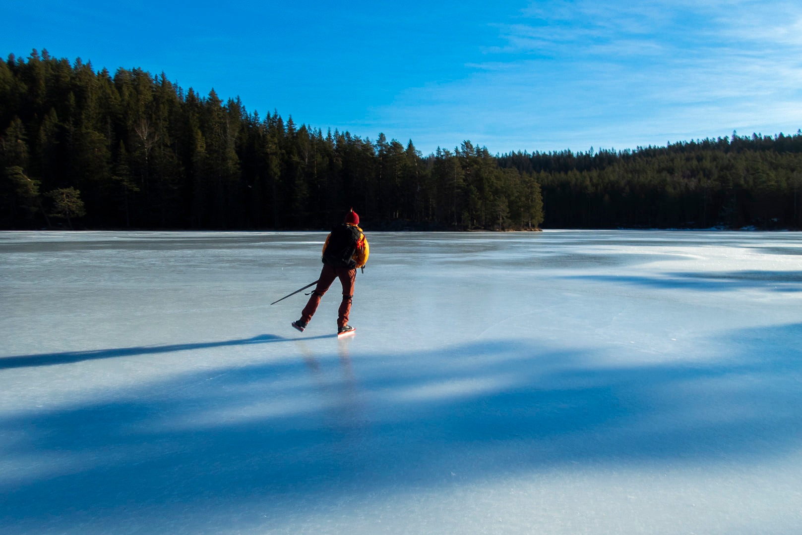 a skater on a frozen lake