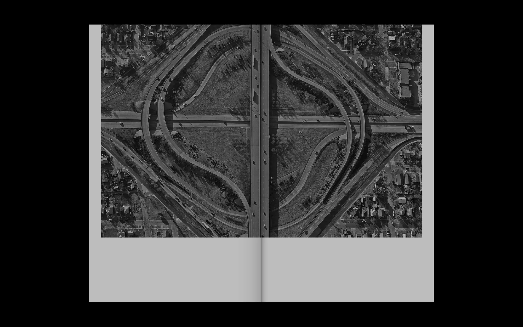 Portfolio Archive from graphic designer Laura Jouan, 2015-present. "Aerial view of a cloverleaf highway interchange surrounded by urban neighborhoods."