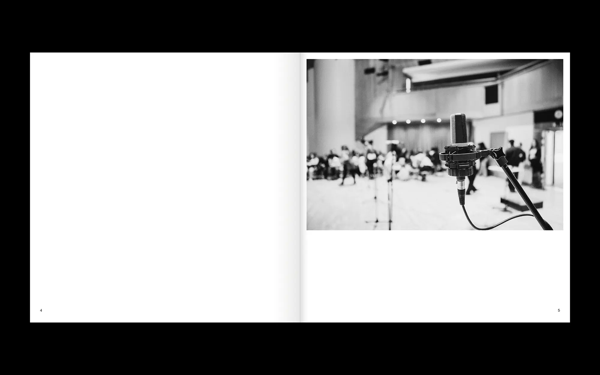 Portfolio Archive from graphic designer Laura Jouan, 2015-present. Editorial: "Black and white photo of a microphone in focus on a stand with a blurred group of people in the background in a large indoor space."