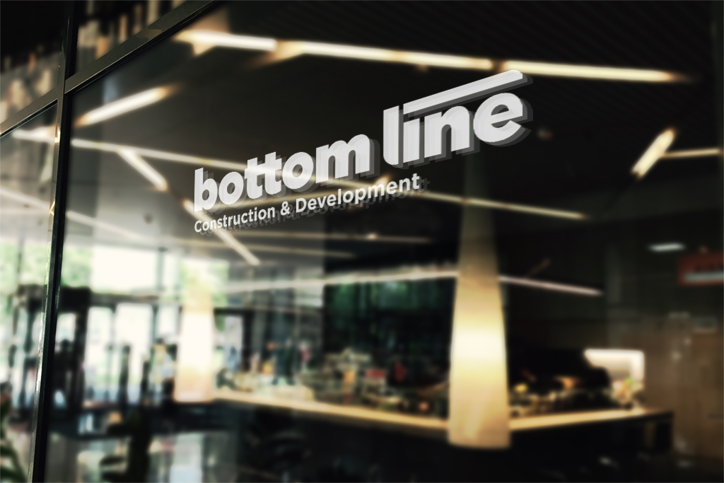 Bottom Line wordmark on glass