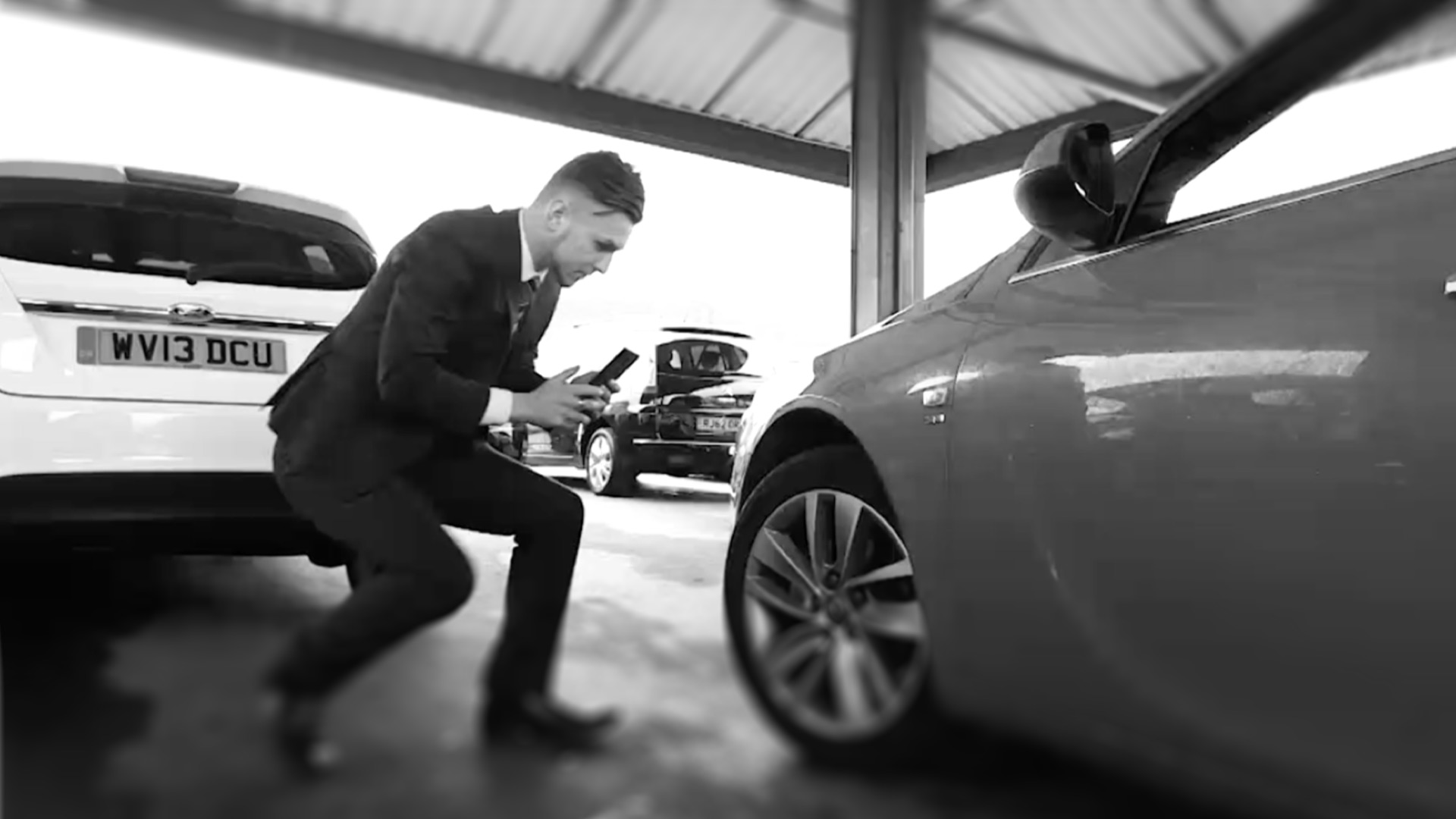 Man appraising car