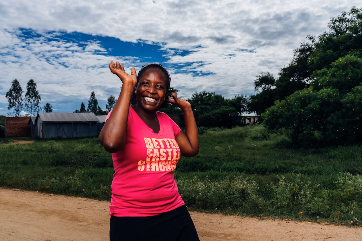 Photo of woman cheering in Kenya.