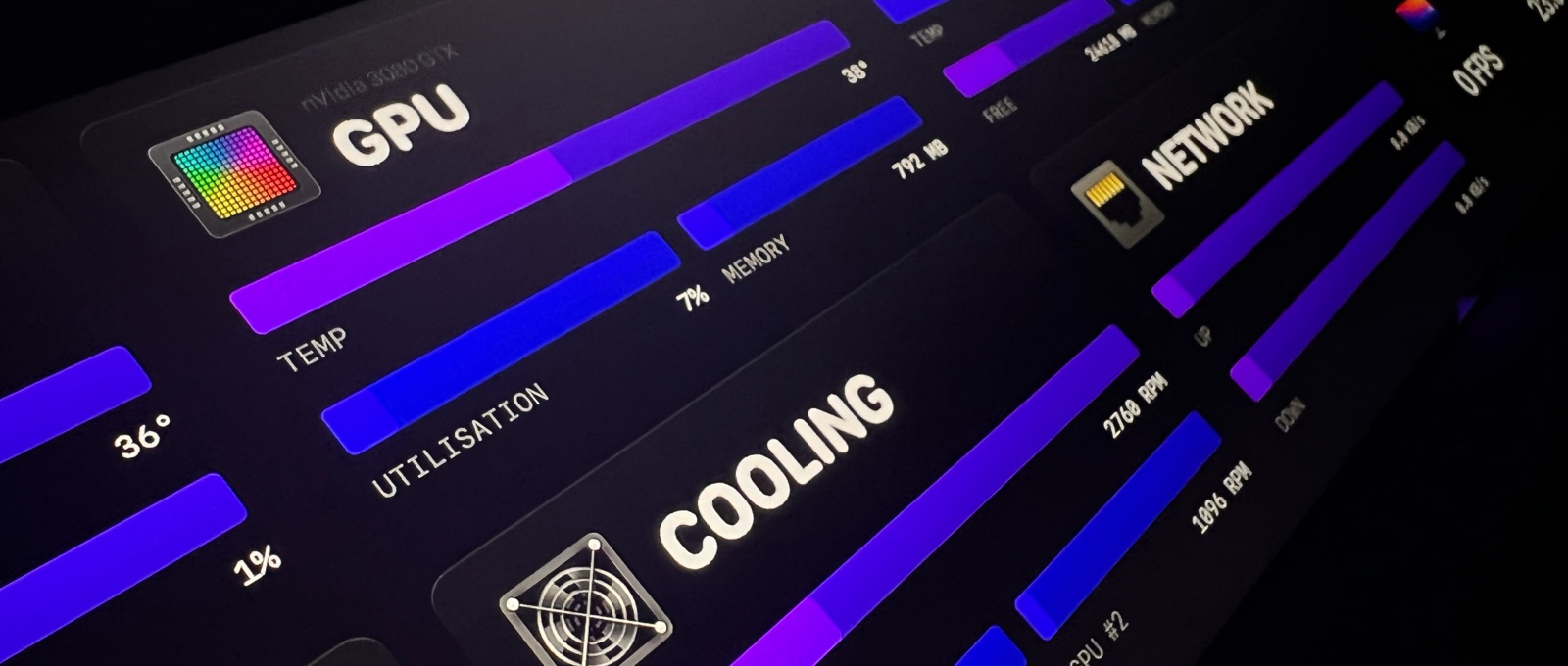 A view of the short but wide monitoring display which sits beneath the main monitor. This display shows live statistics from the computer such as temperatures and use.