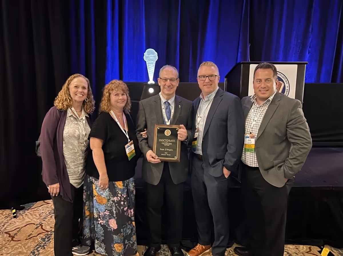The IntegraSys team posing with Peter after he received his Doctorate of Ice Cream
