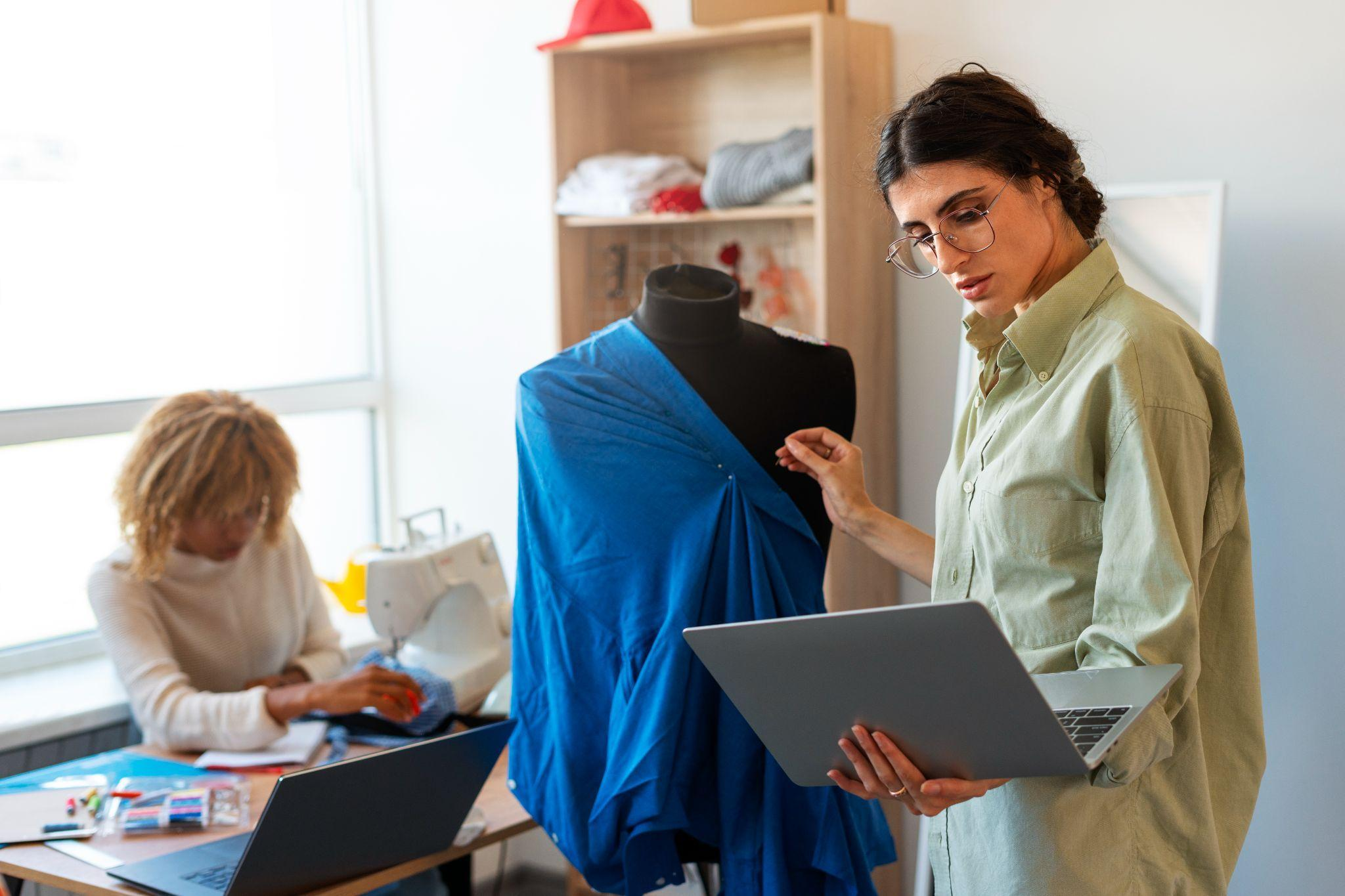 A designer examining fabric