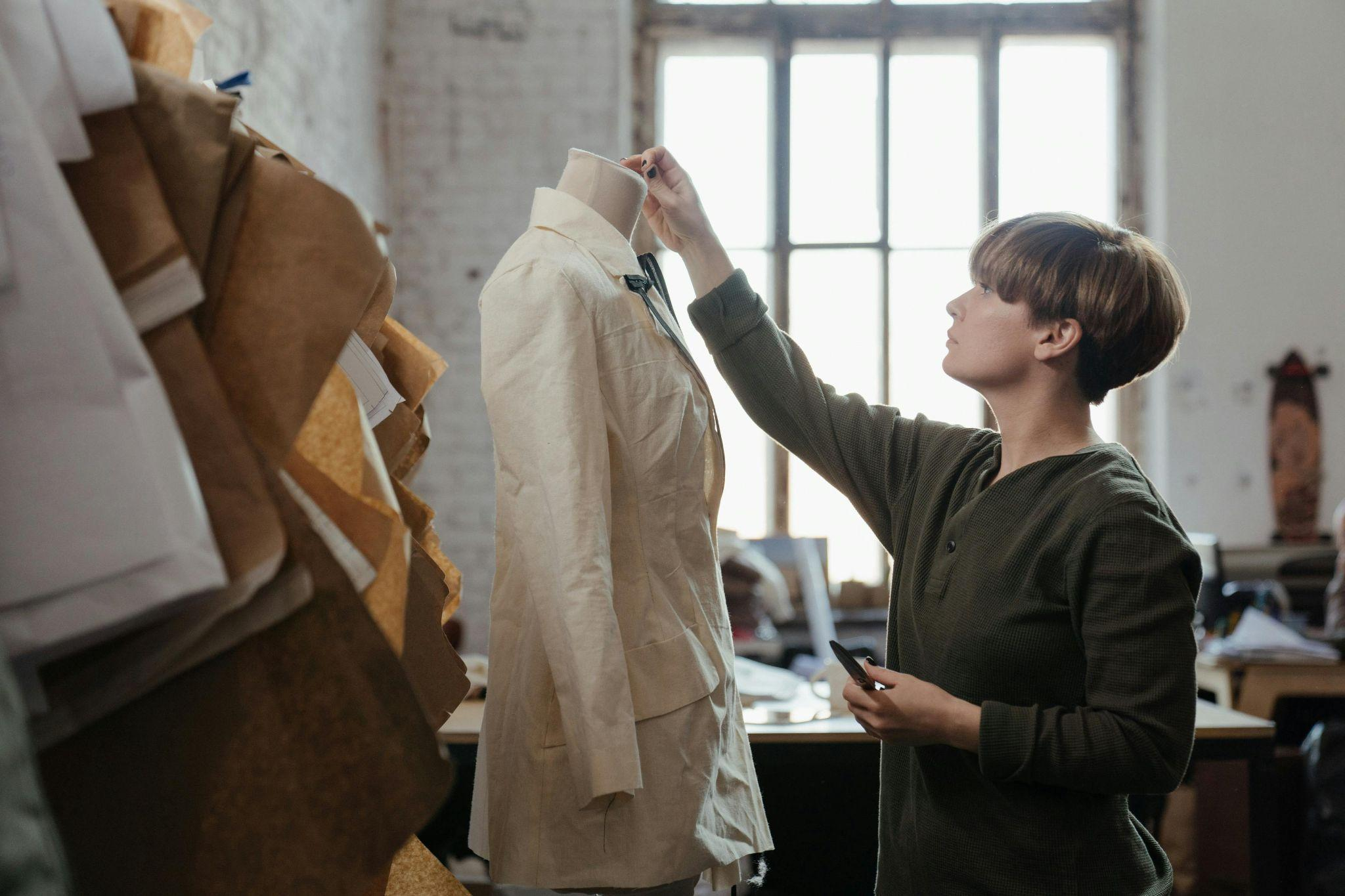 A designer personalizing a garment