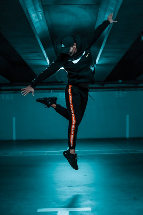 Man jumping in a high-fashion athletic wear